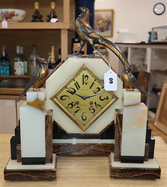 An Art Deco Gauvin, mixed marble clock garniture surmounted with stylised bronze pheasants, signed Frecourt H.42cm